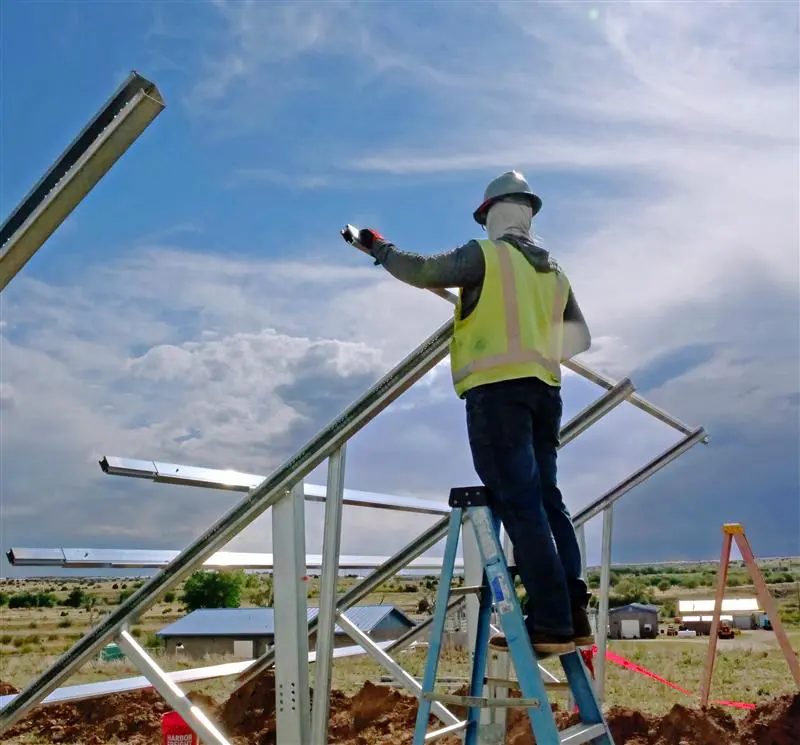 Nexus solar professional working on a ground-mount installation